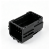Black rectangular multi‑pin connector socket housing with exposed terminals, inner locking slots and deep wiring cavity