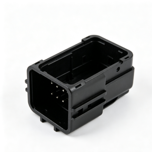 Black rectangular multi‑pin connector socket housing with exposed terminals, inner locking slots and deep wiring cavity