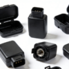 Black plastic OBD connector housing and flip lid enclosure set for automotive electronic modules