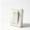 Cream rocker switch with an indicator window in the paddle and a ribbed side wall on the molded body