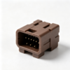 Brown connector housing with gold pins in a recessed cavity, top latch rib and side guide rails