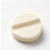 Off-white round cap with a wide raised bar running diagonally across its flat top face and a rounded side wall