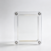 Transparent cover panel with four dark corner bushings and a raised inner window frame