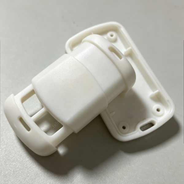 227 White plastic connection housing with connector body, slot structure, mounting holes and snap-fit ribs, custom molded part