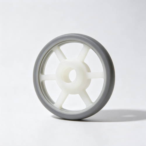White plastic roller hub with radial ribs, central bore and a grey elastic outer ring, custom injection molded part