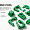 Injection molded plastic brackets and connectors in green, structural parts with mounting holes and connection features