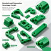 Close-up of a green plastic connector showing the mounting holes, ribbed body and connection feature