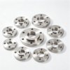 Custom machined flange and disc parts in aluminum and steel, arranged as a group on a white background