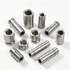 Custom machined bushing and sleeve parts in steel, with inner bores and stepped faces