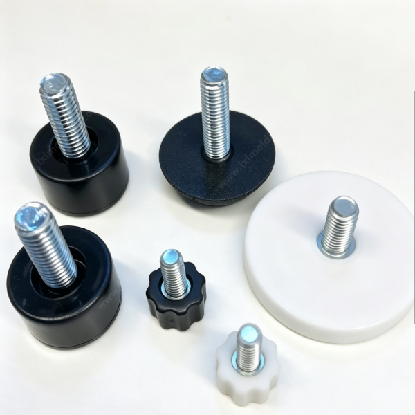 248 Custom leveling foot samples in black and white plastic with threaded studs, shown as a group