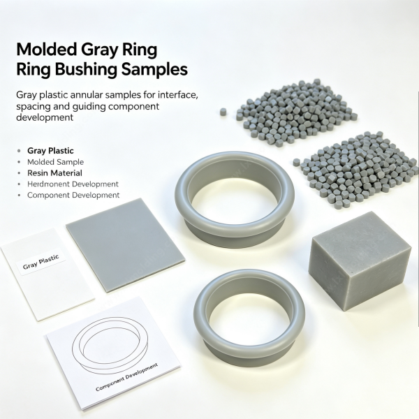249 (4) Molded gray ring bushing samples with gray pellets and a component development card