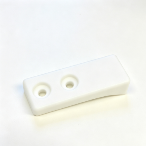 Molded connecting plate in white, a flat molded part with two counterbored holes