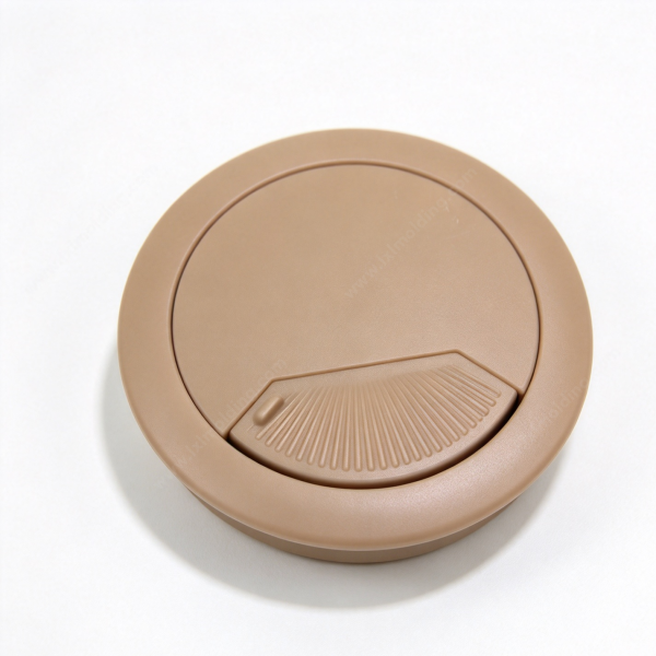 253 Custom cable grommet in tan, a round flip cover desk port seen from above on a white background