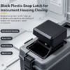 Black plastic snap latch fitted for instrument housing closing, shown as a quick lock case closure