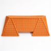 Miniature roof in orange, a molded two-slope roof shell with a beaded ridge cap on a white background