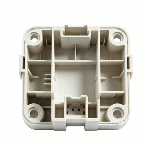 87 Off‑white partitioned multi‑cell plastic module casing with dividing ribs and dual internal connector sockets