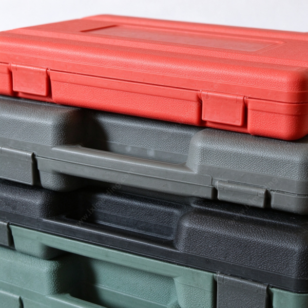 295 (2) Tool box set close up at the corner of a stack, showing the pebble texture, the parting line and a latch