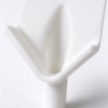 Drainage nozzle close up, the smooth V trough blending into the round spout with no step inside the flow path