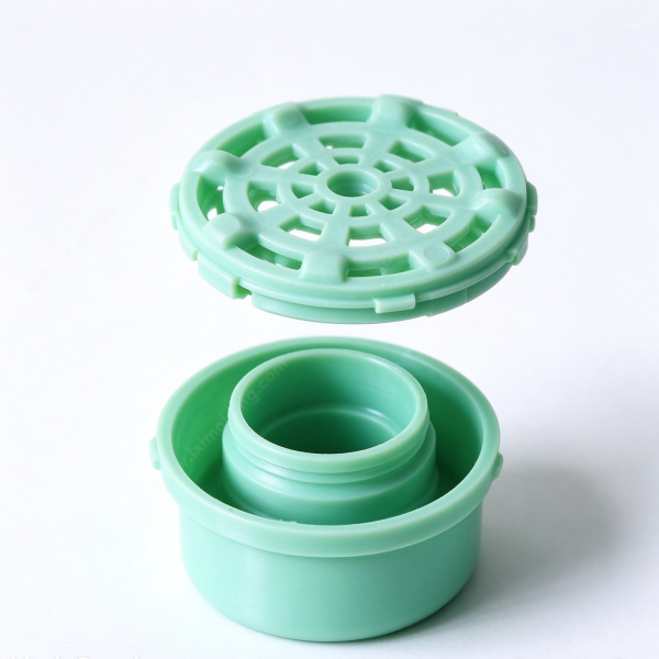 304 (2) Filter cover assembly shown apart, the mesh cap lifted off the threaded neck of the cylindrical base