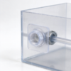 Bulkhead fitting mounted through a clear tank wall, with a locknut and a tube through the bore