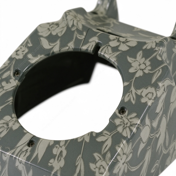 317 (1) Printed enclosure in gray, the sloped walls carrying the print and the round front opening standing on a white floor