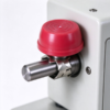 Plastic dome cap pressed on a machine shaft end above the star shaped fitting and the steel shaft