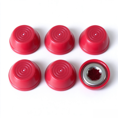 Plastic dome cap in red, six caps with one turned over to show the metal insert and the star shaped seat