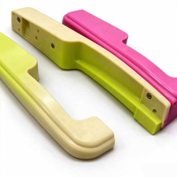 327 (1) Underside of a u pull handle showing both mounting pads, the molded screw bosses and the fixing screws fitted in them