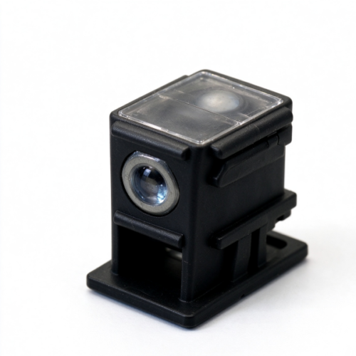 Optical sensor housing in black, a molded body with a clear window in the top face and a round lens port in the front