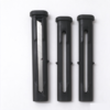 Utility knife housing in black, one sleeve open with a utility blade inside and two empty sleeves beside it