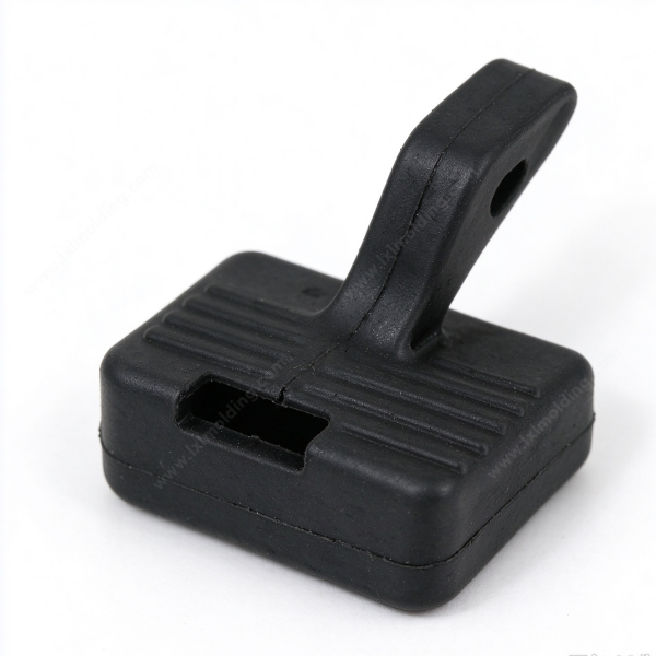 337 (2) Rubber buffer buckle in black at an angle, the ribbed pad and the strap loop with a hole through its end