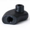 Curved plastic bracket up close, the counterbored boss and its bore standing on the swept body